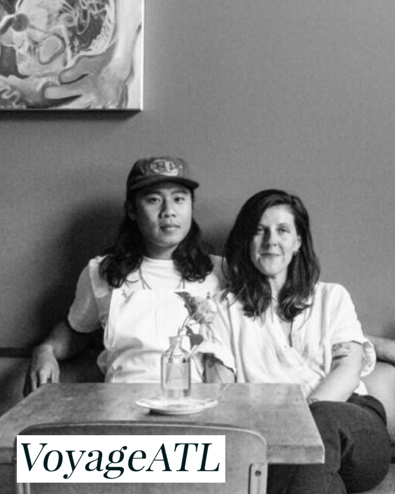 Pete Amadhanirundr and Ally Smith sitting in their restaurant Puma Yu's
